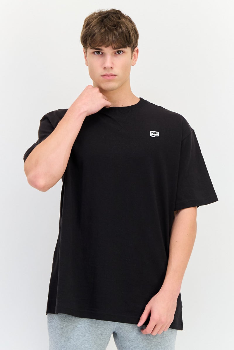 PUMA Men Relaxed Fit Short Sleeve Downtown Badge Outdoor T-Shirt, Black - Image 1